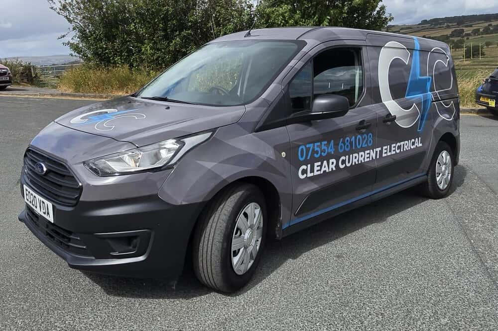 Clear Current Electrical branded work van parked on a Leeds hillside road